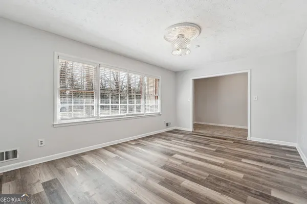a view of an empty room with a window