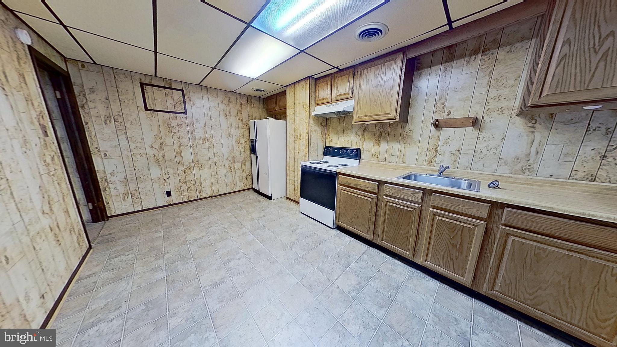 17 East Main Street, Unit 2 Dallastown, PA 17313 - Photo 3 of 8 a view of a kitchen with electric appliances