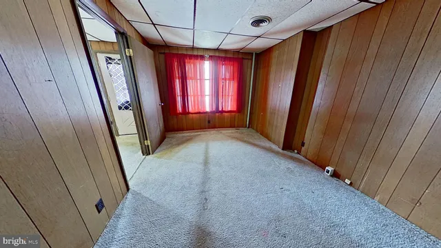 a view of a hallway with windows