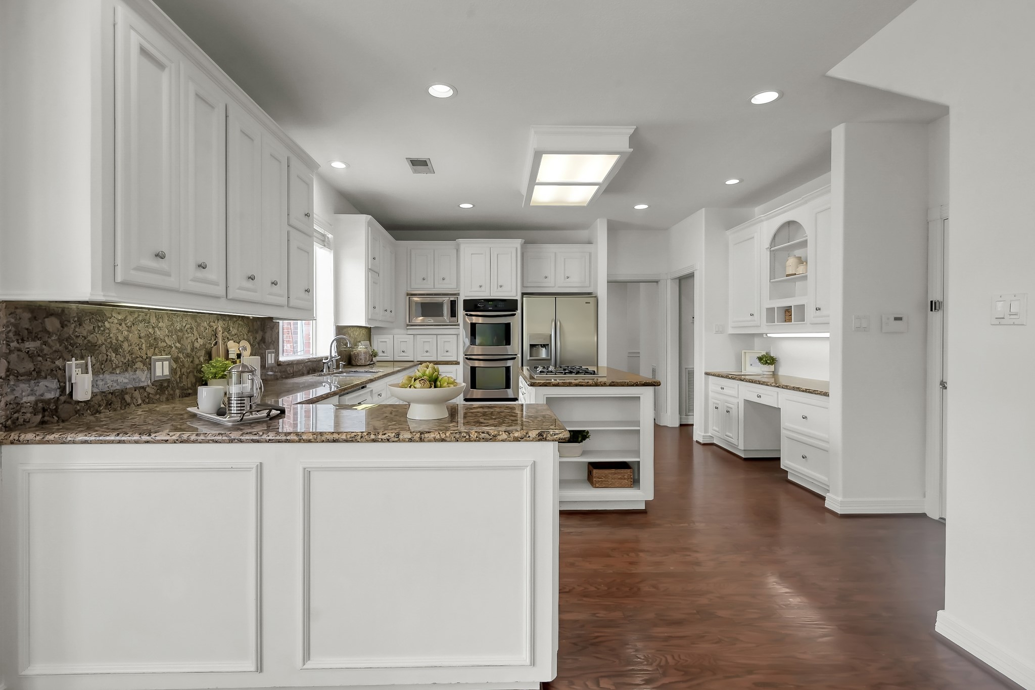 16403 Agusta Court Spring, TX 77379 - Photo 12 of 36 a kitchen with stainless steel appliances granite countertop a sink and cabinets