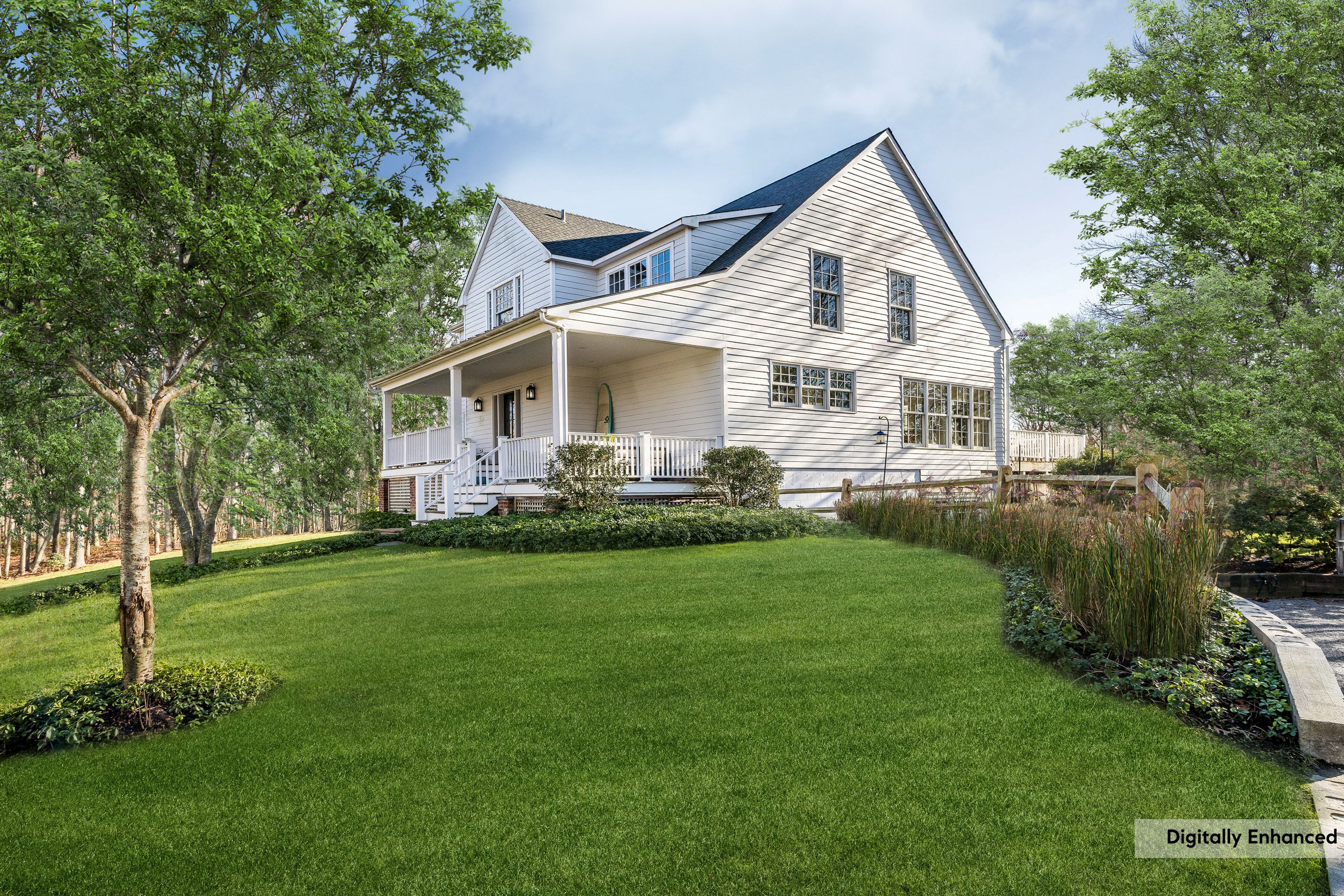 1499 Noyac Path Sag Harbor, NY 11963 - Photo 3 of 22 a front view of a house with a garden and trees