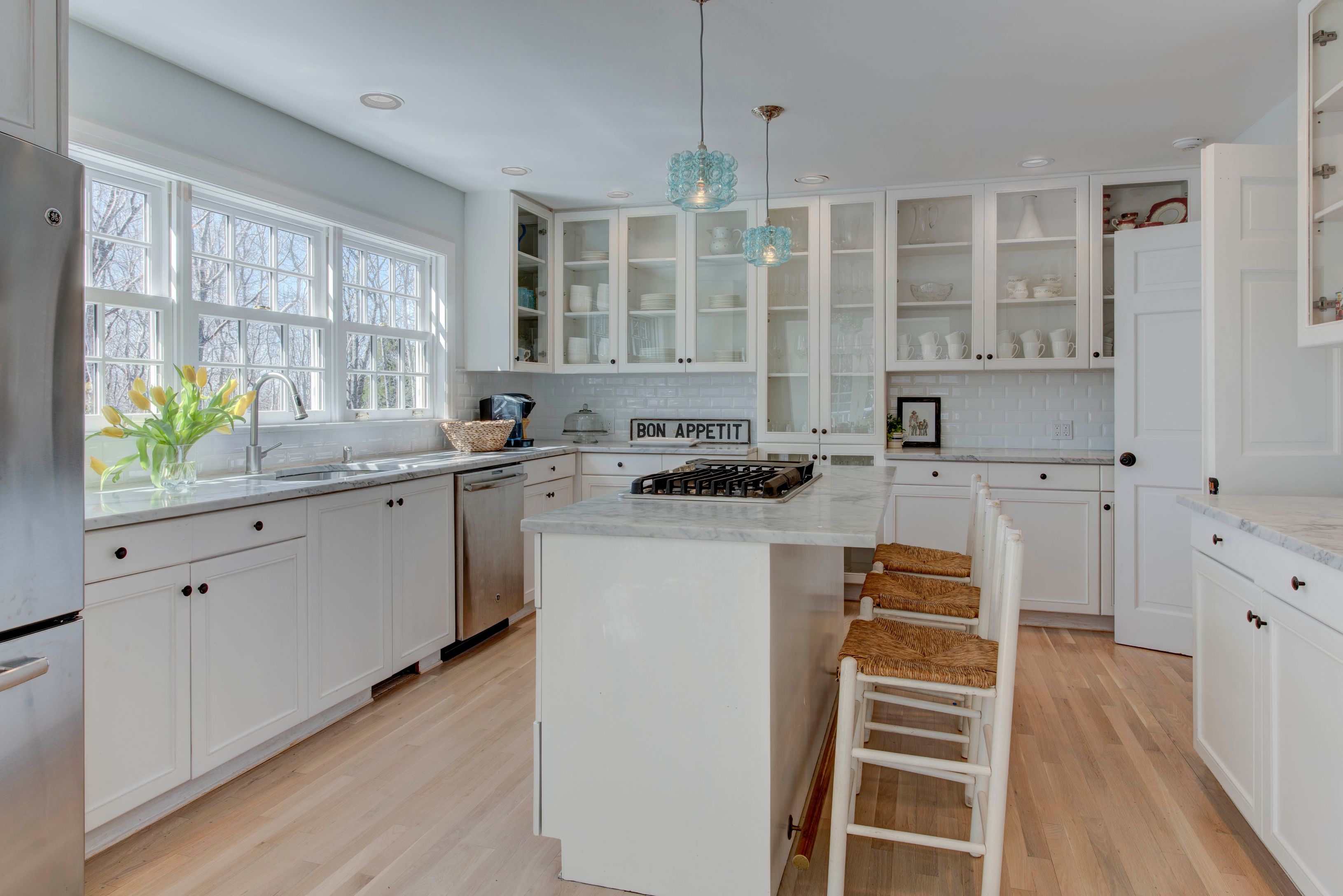 1499 Noyac Path Sag Harbor, NY 11963 - Photo 8 of 22 a kitchen with stainless steel appliances a sink stove and cabinets