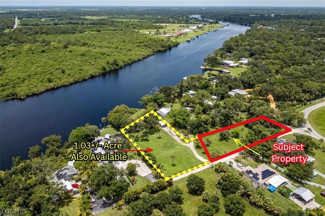 2014 Fort Denaud Road LaBelle, FL 33935 - Photo 11 of 11 view of a lake with a building in the background