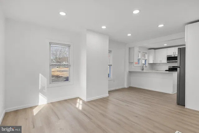 a view of kitchen with wooden floor
