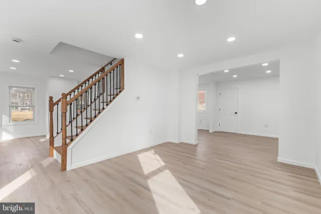 a view of an entryway with wooden floor
