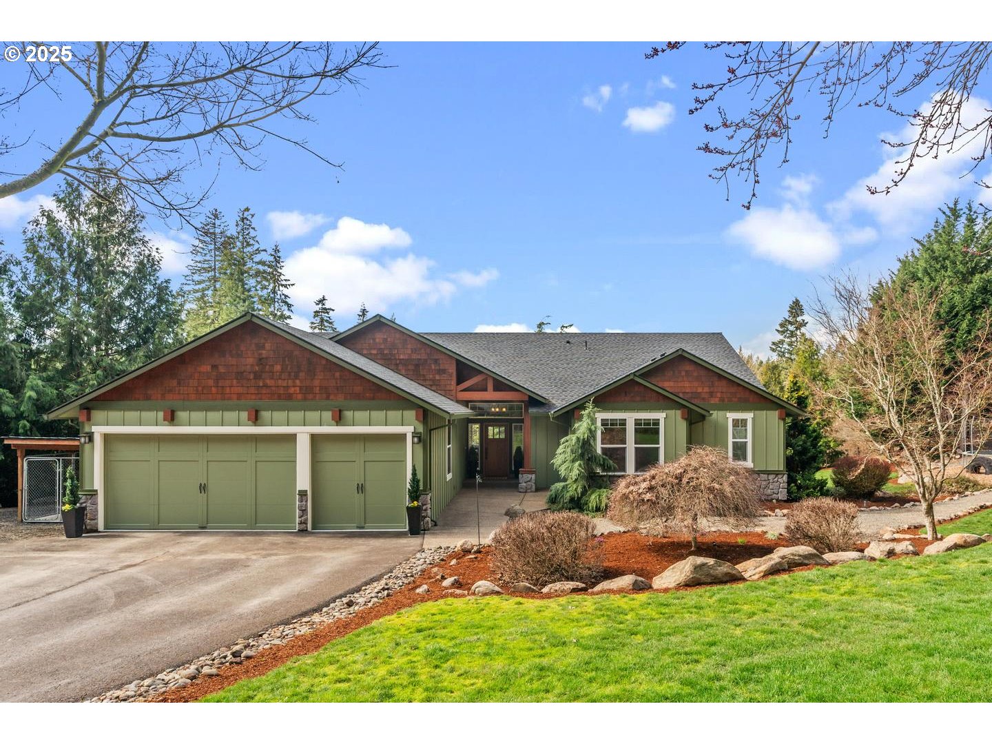 21481 South Ridge Road Oregon City, OR 97045 - Photo 1 of 48 a front view of a house with a garden