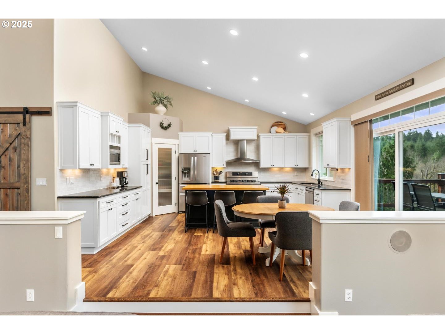 21481 South Ridge Road Oregon City, OR 97045 - Photo 11 of 48 a kitchen with stainless steel appliances kitchen island granite countertop a sink and cabinets