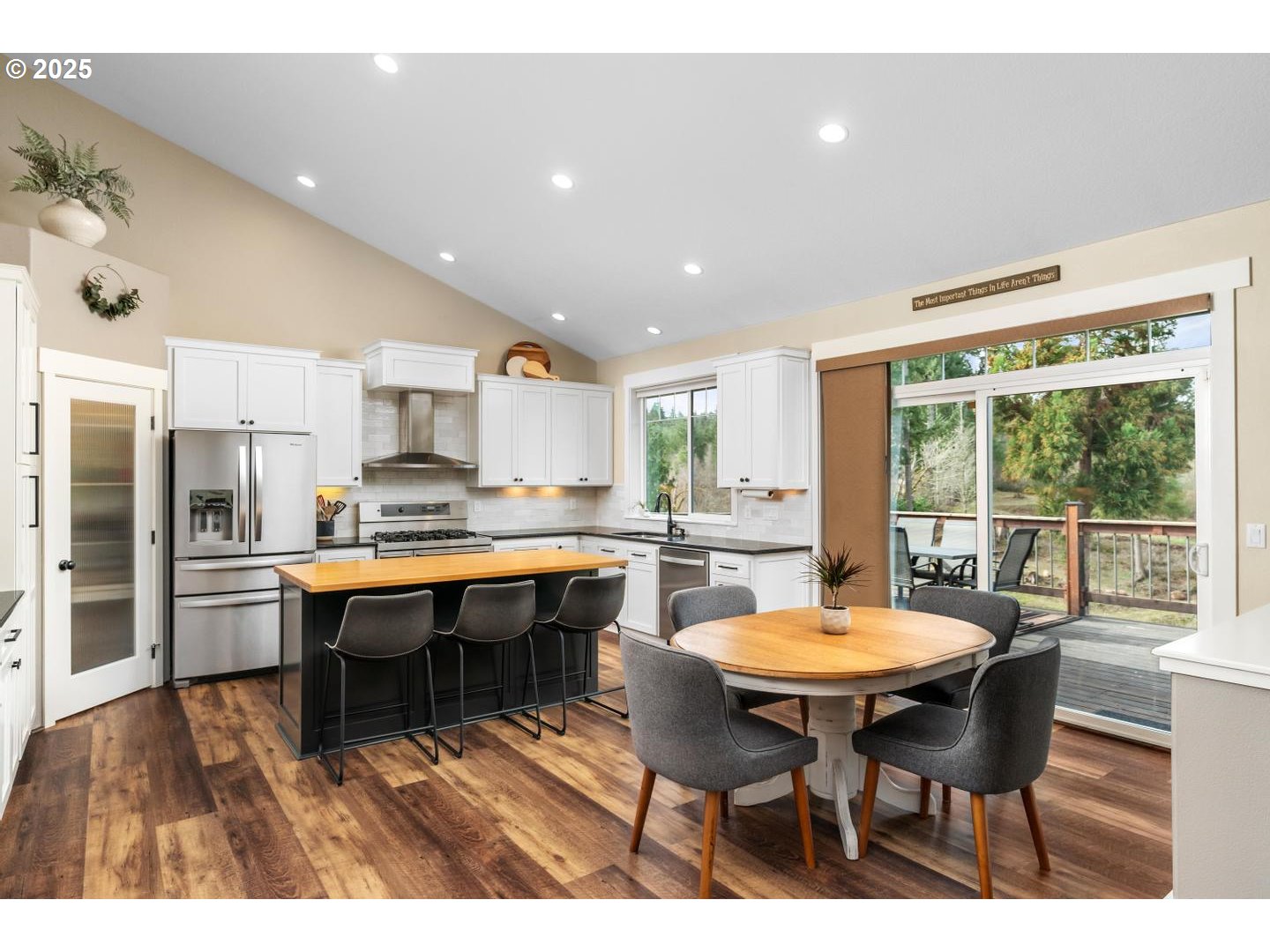 21481 South Ridge Road Oregon City, OR 97045 - Photo 12 of 48 a dining room with stainless steel appliances a table and chairs