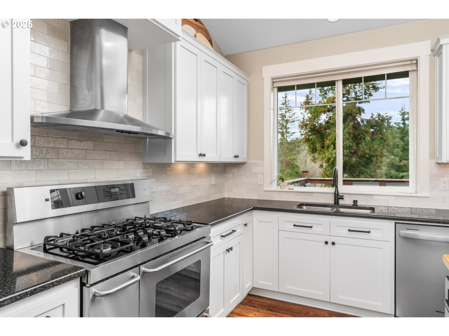 21481 South Ridge Road Oregon City, OR 97045 - Photo 15 of 48 a kitchen with white cabinets and appliances