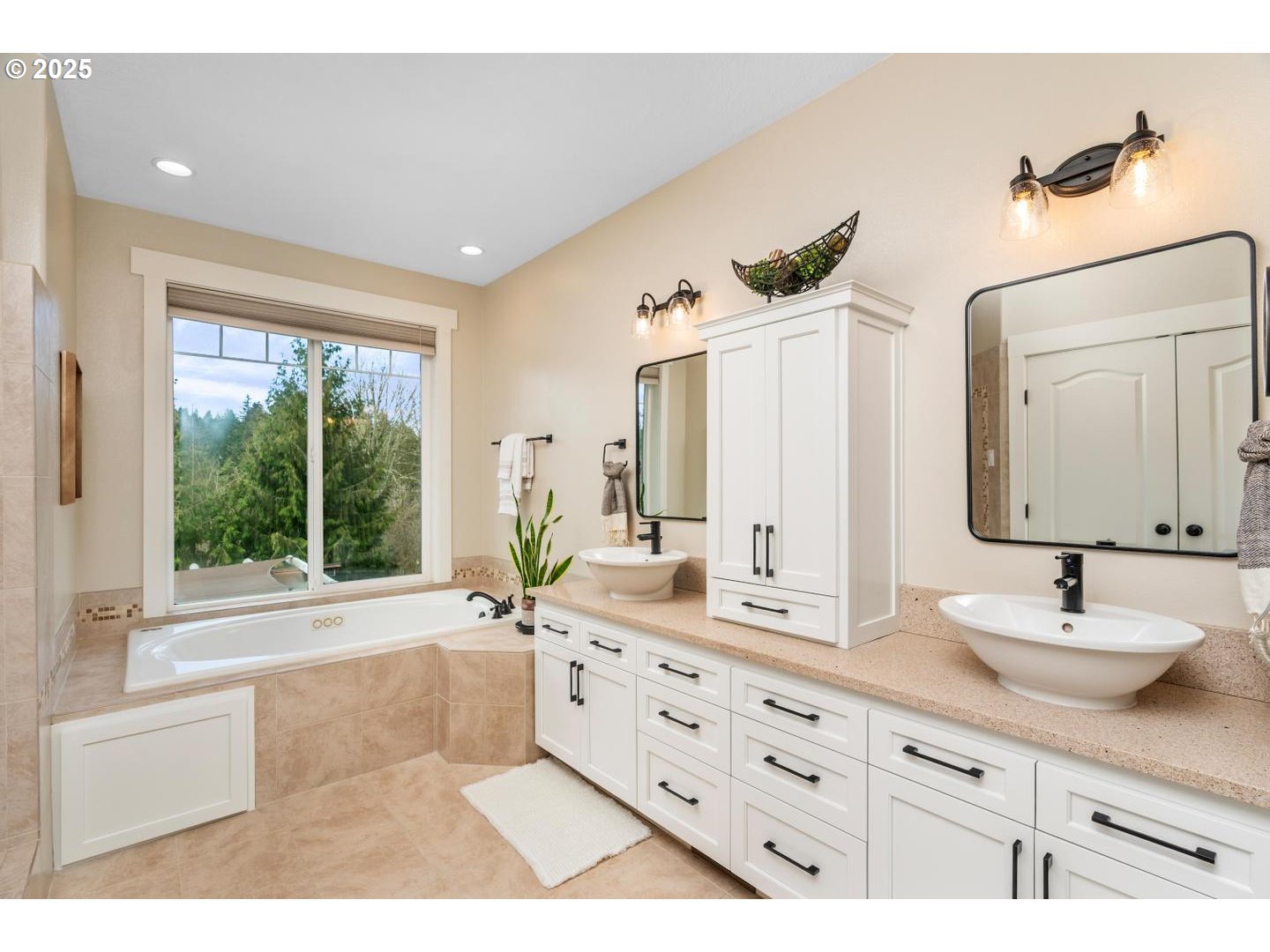 21481 South Ridge Road Oregon City, OR 97045 - Photo 20 of 48 a bathroom with a double vanity sink bathtub and next to a window