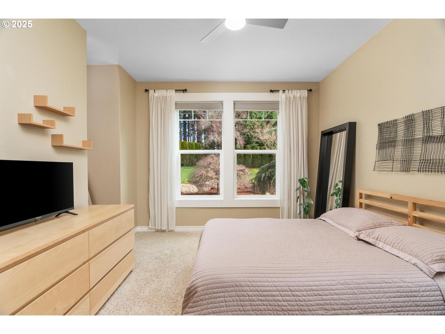 21481 South Ridge Road Oregon City, OR 97045 - Photo 23 of 48 a bedroom with a large bed and a tv