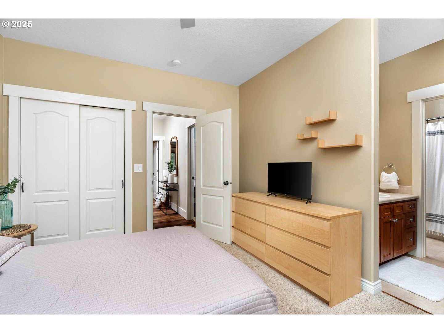 21481 South Ridge Road Oregon City, OR 97045 - Photo 24 of 48 a bedroom with a bed and a flat tv screen