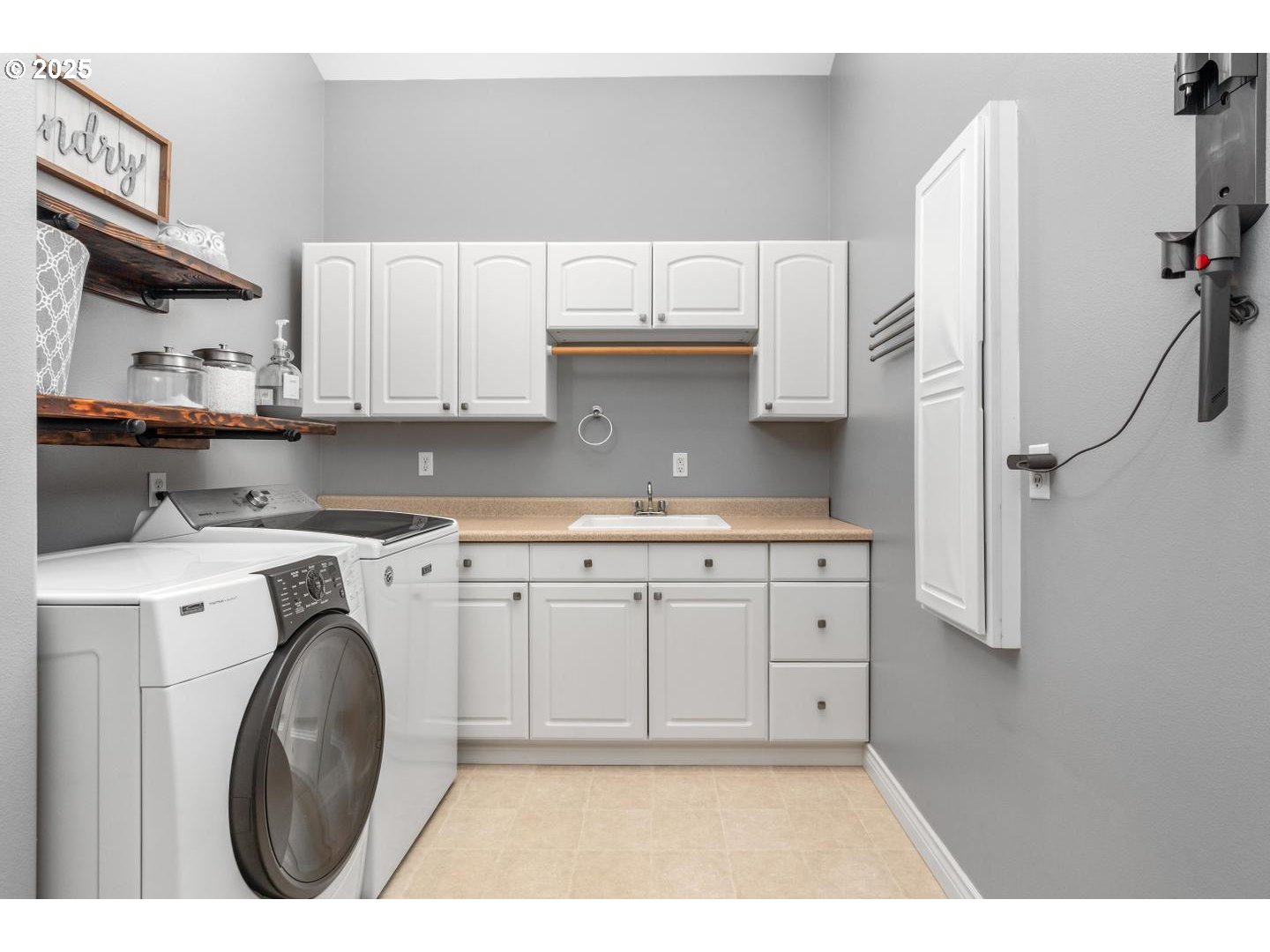 21481 South Ridge Road Oregon City, OR 97045 - Photo 25 of 48 a utility room with cabinets washer and dryer
