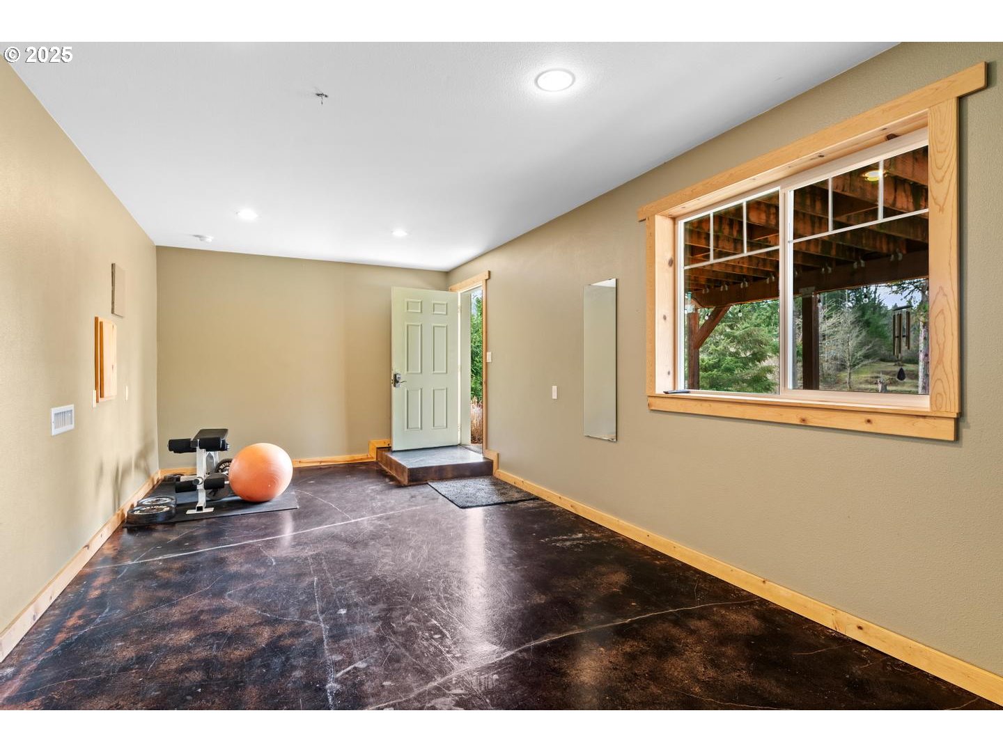 21481 South Ridge Road Oregon City, OR 97045 - Photo 26 of 48 a view of an empty room with wooden floor and windows