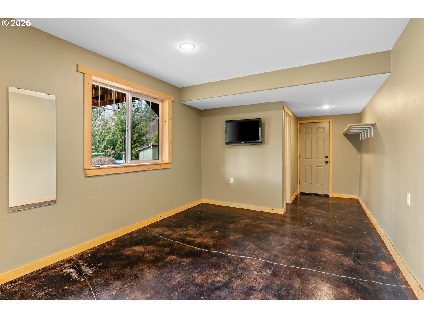 21481 South Ridge Road Oregon City, OR 97045 - Photo 27 of 48 a view of an empty room with wooden floor and a window