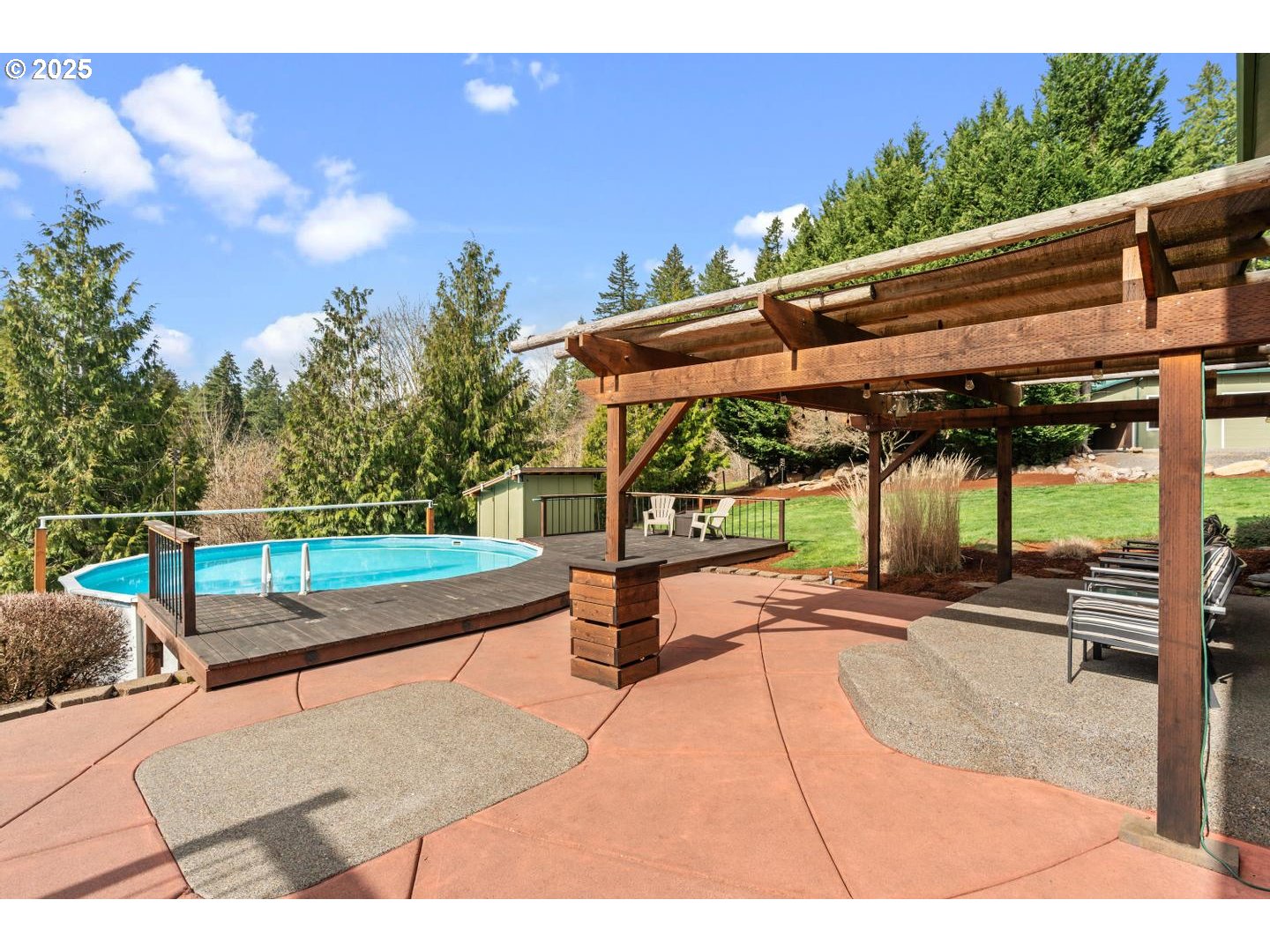 21481 South Ridge Road Oregon City, OR 97045 - Photo 32 of 48 a patio with table and chairs