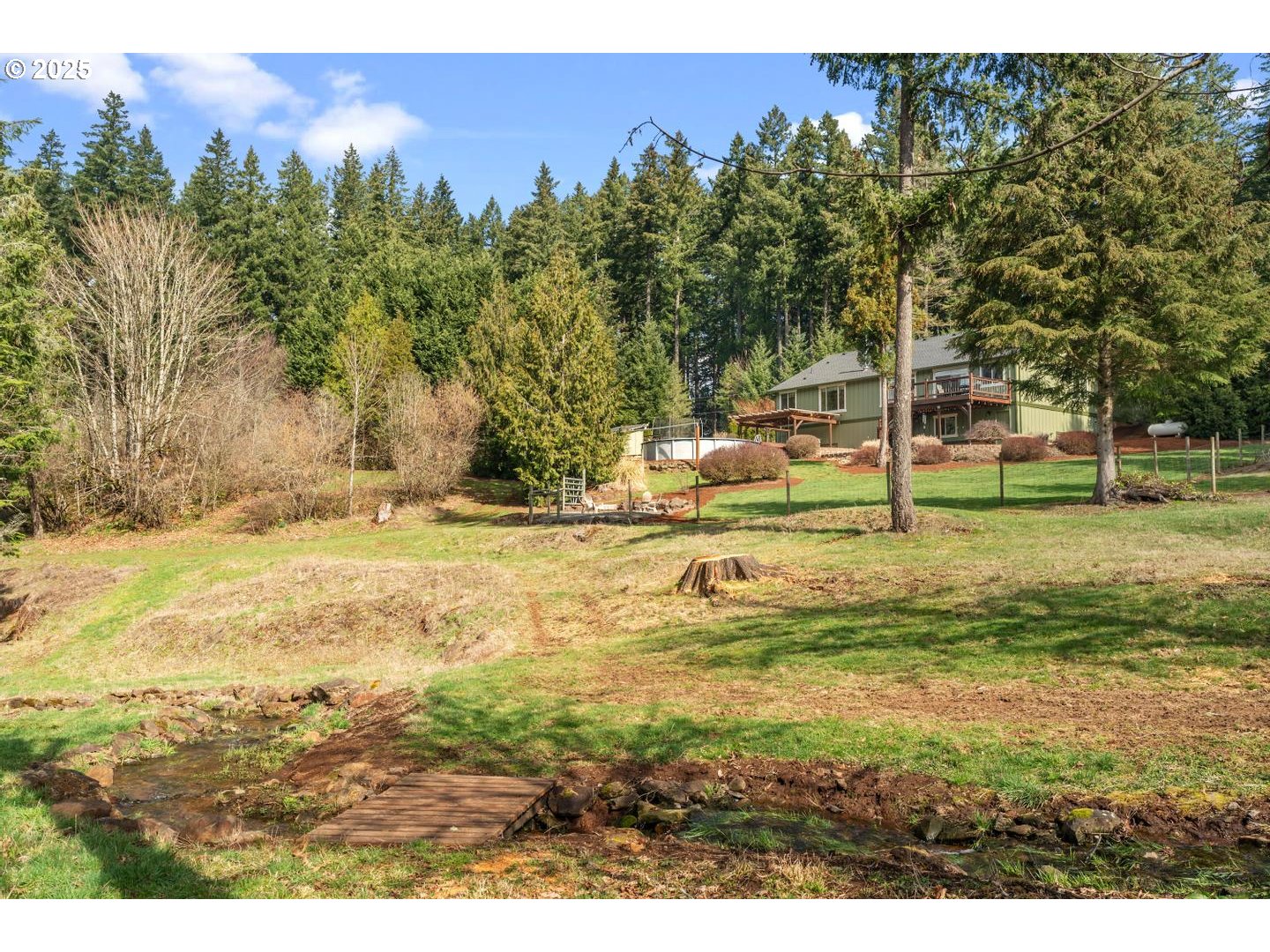 21481 South Ridge Road Oregon City, OR 97045 - Photo 37 of 48 a view of a swimming pool with an outdoor space and seating area