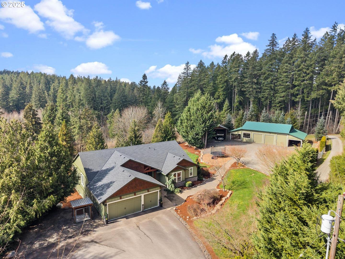 21481 South Ridge Road Oregon City, OR 97045 - Photo 4 of 48 a view of a house with yard and trees in the background