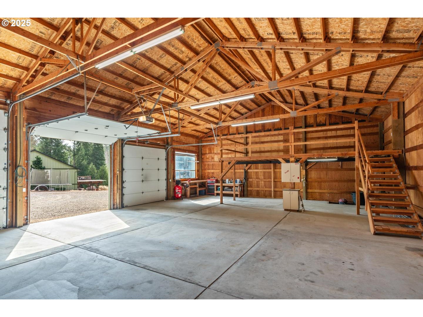 21481 South Ridge Road Oregon City, OR 97045 - Photo 47 of 48 a view of a big room with an empty space