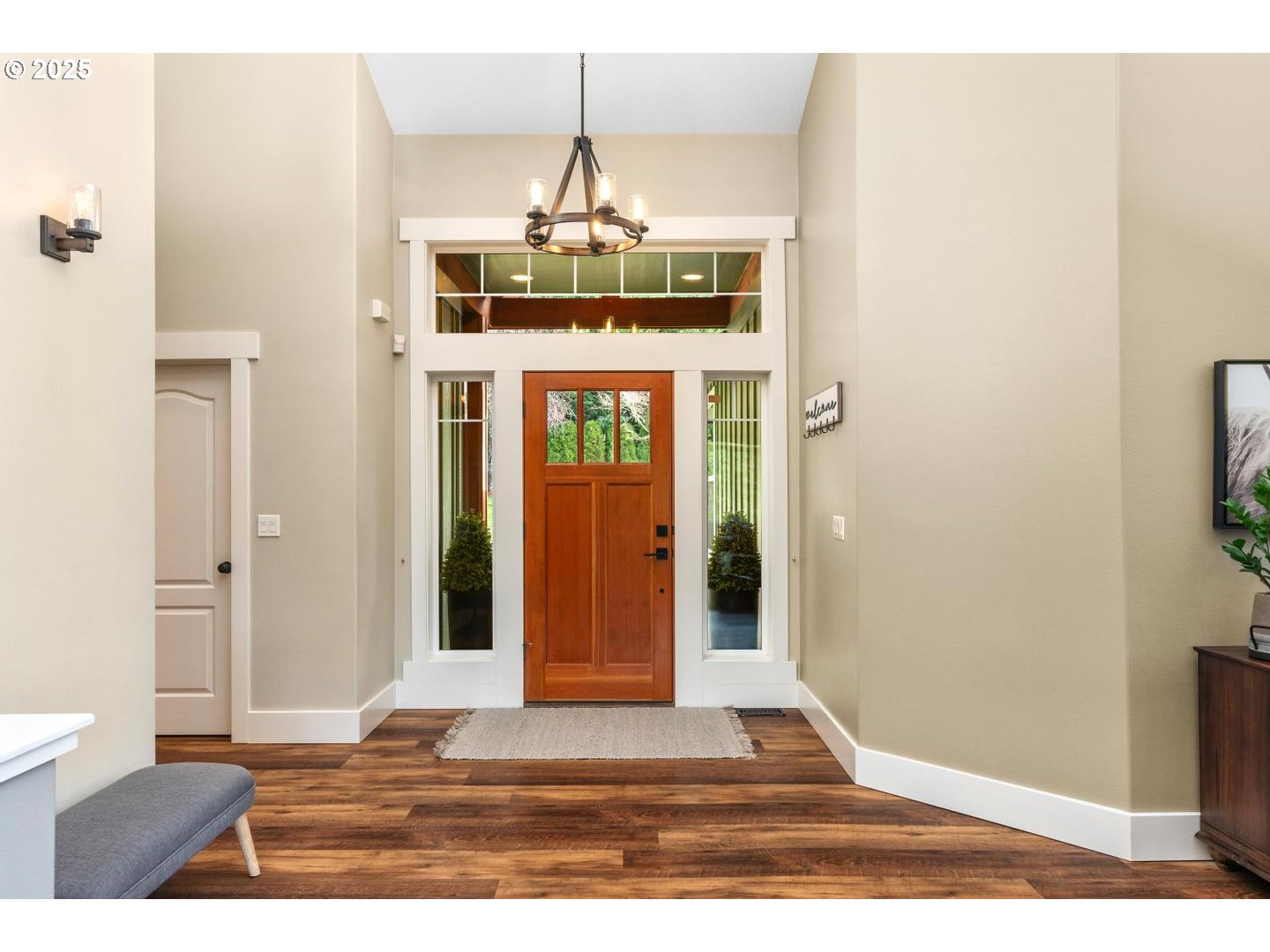 21481 South Ridge Road Oregon City, OR 97045 - Photo 8 of 48 a view of a hallway with wooden floor and chandelier