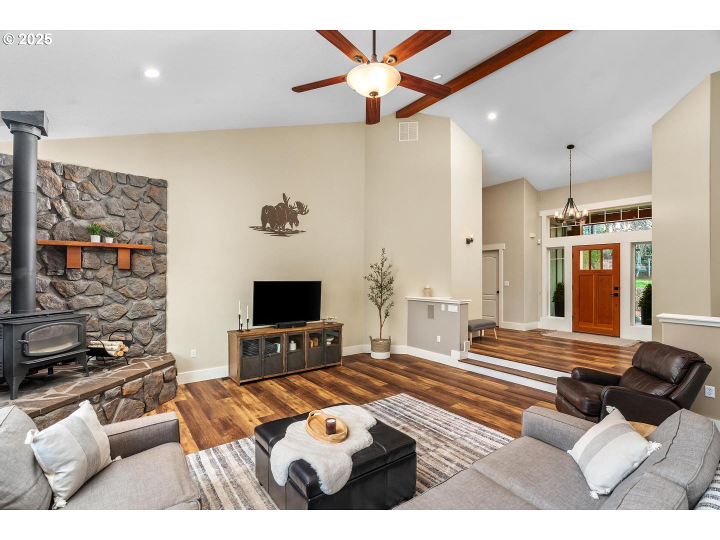 21481 South Ridge Road Oregon City, OR 97045 - Photo 9 of 48 a living room with furniture and a flat screen tv
