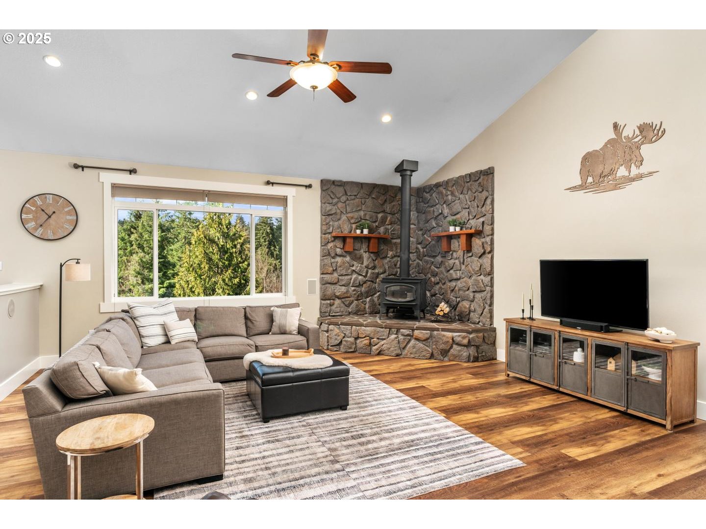 21481 South Ridge Road Oregon City, OR 97045 - Photo 10 of 48 a living room with furniture and a flat screen tv