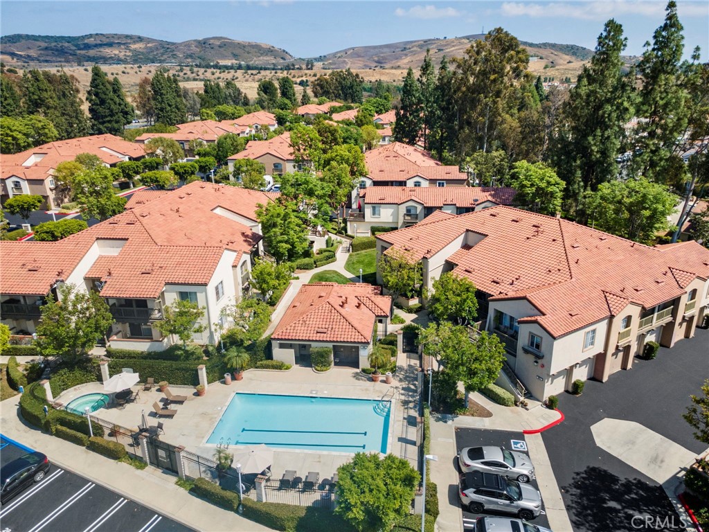 215 South Cross Creek Road, Unit L Orange, CA 92869 - Photo 45 of 50 an aerial view of multiple houses with yard