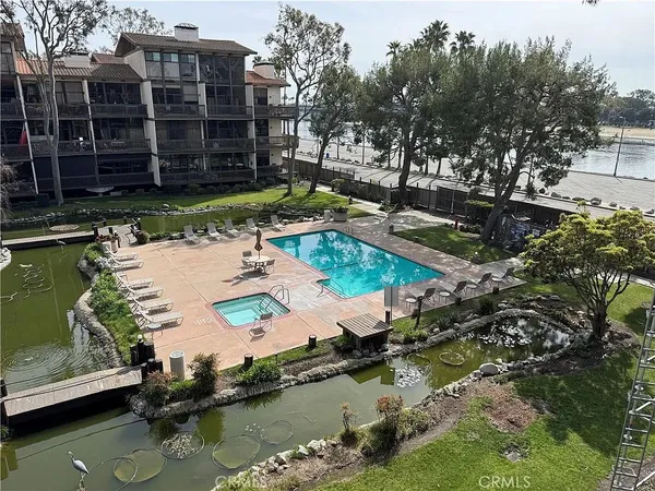 a view of swimming pool with outdoor seating and yard