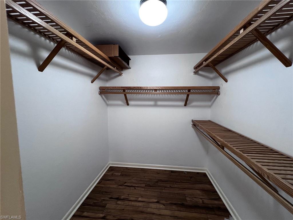 1801 Courtyard Way, Unit D201 Naples, FL 34112 - Photo 17 of 37 wooden floor in an empty room