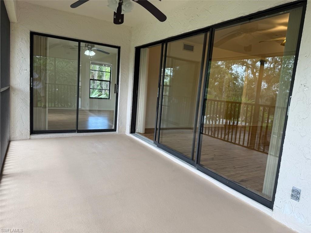 1801 Courtyard Way, Unit D201 Naples, FL 34112 - Photo 25 of 37 a view of empty room with floor to ceiling window
