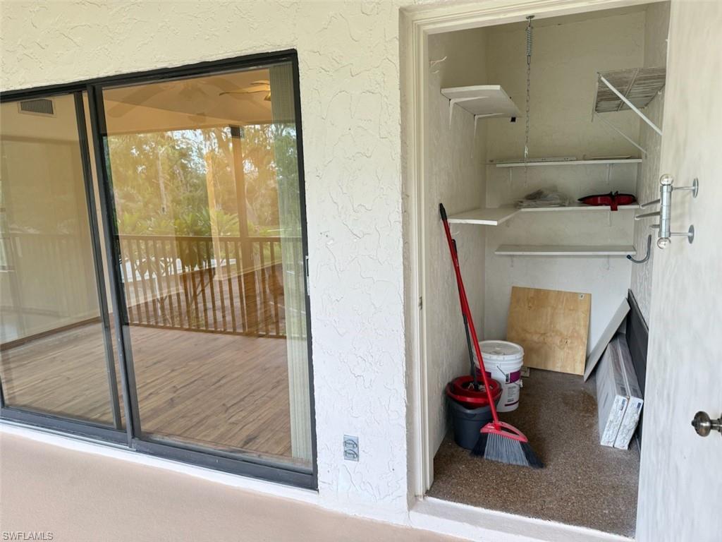 1801 Courtyard Way, Unit D201 Naples, FL 34112 - Photo 29 of 37 a view of a hallway