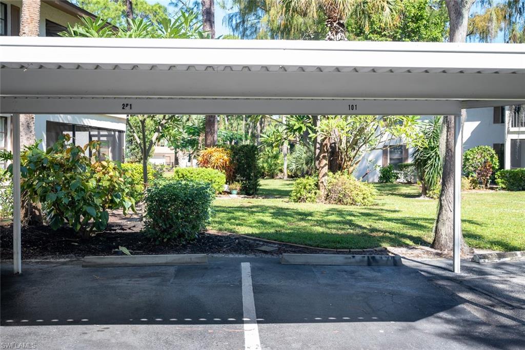 1801 Courtyard Way, Unit D201 Naples, FL 34112 - Photo 32 of 37 a view of outdoor space and yard