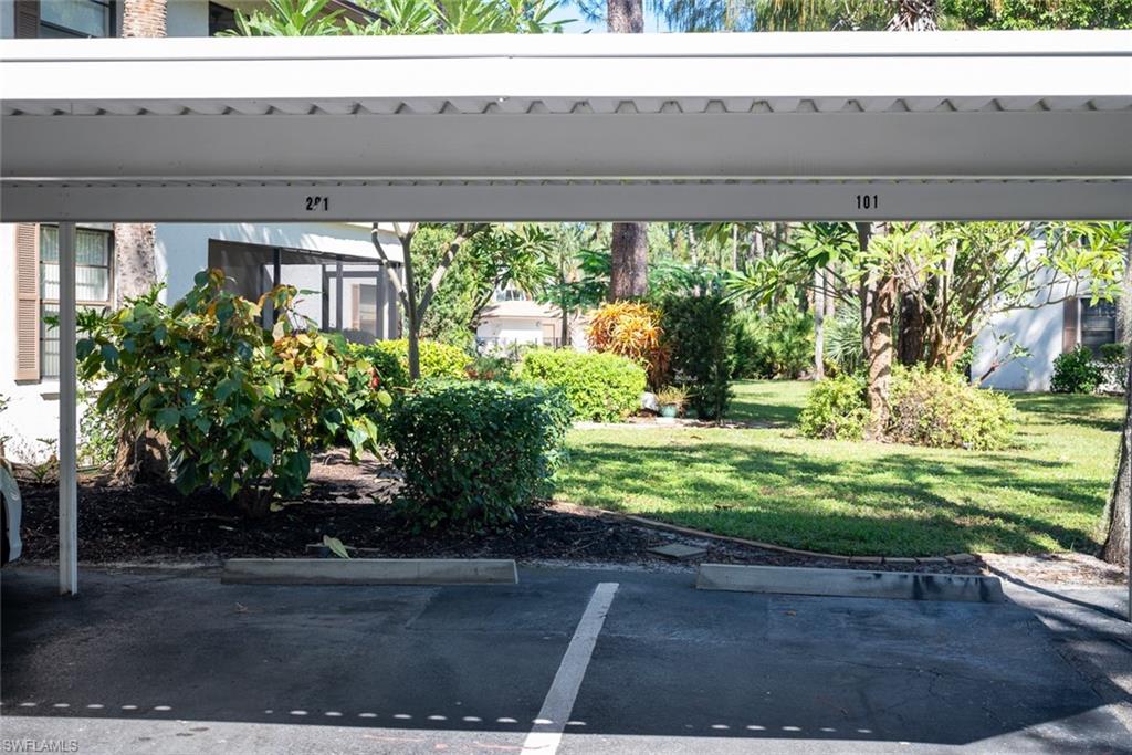 1801 Courtyard Way, Unit D201 Naples, FL 34112 - Photo 34 of 37 a view of outdoor space and yard