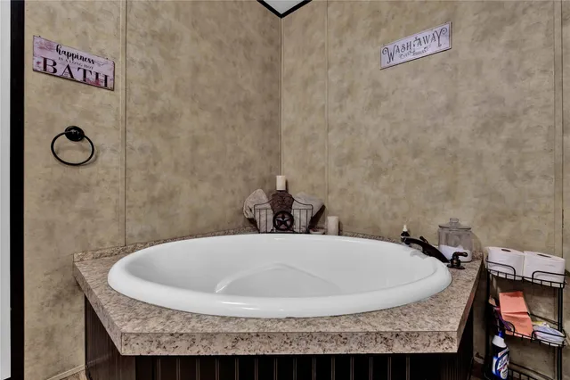 a bath tub sitting next to a shower