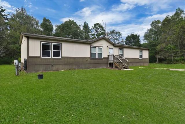 a view of a backyard with a garden and plants