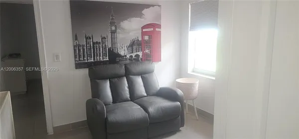 a couple of chairs sitting next to a window