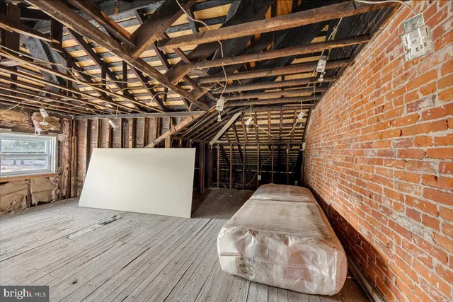 a view of a wooden chairs and table in the wooden house