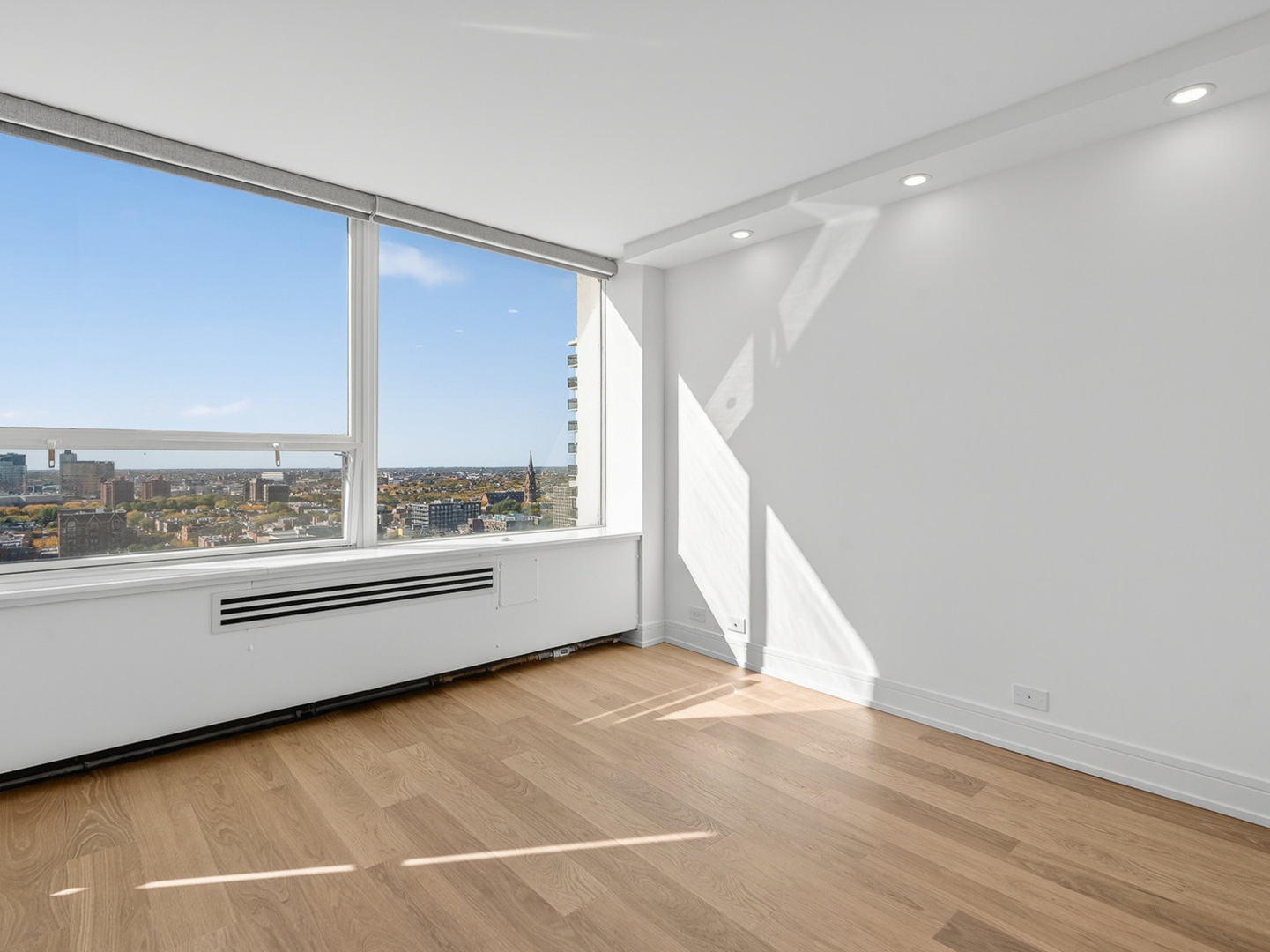 1455 North Sandburg Terrace, Unit 2403 Chicago, IL 60610 - Photo 12 of 22 a view of an empty room with a window