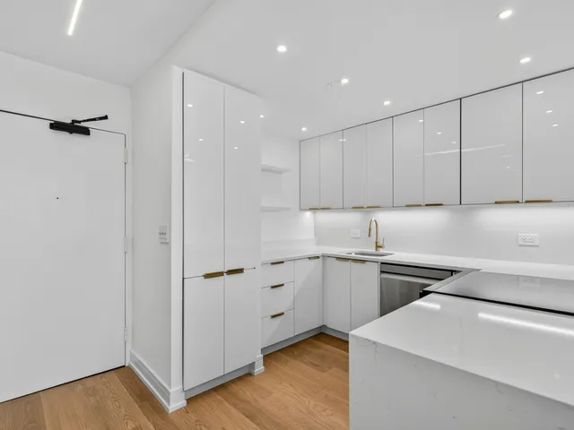 a kitchen with a stove and a refrigerator