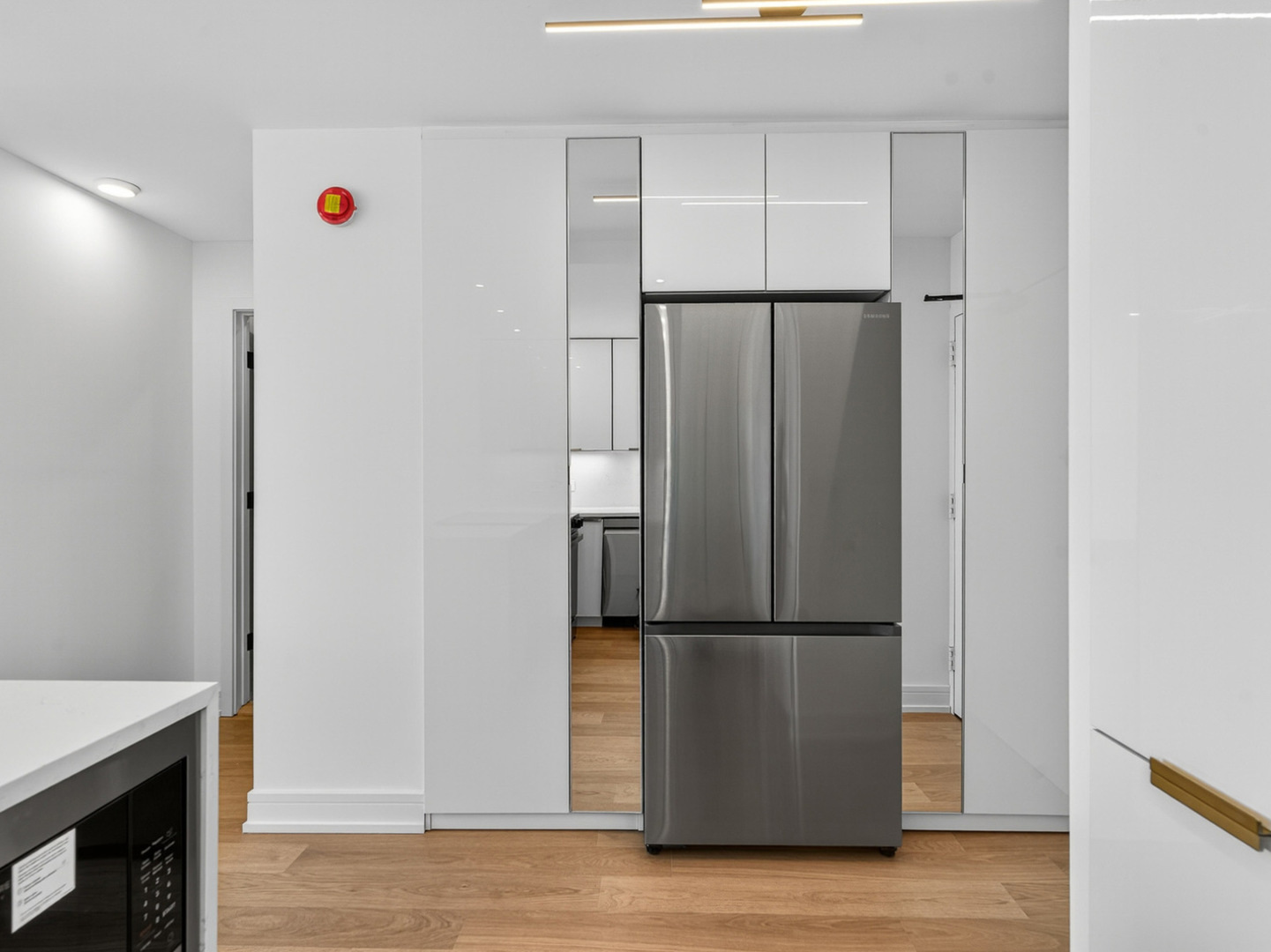 1455 North Sandburg Terrace, Unit 2403 Chicago, IL 60610 - Photo 17 of 22 a view of kitchen with furniture and refrigerator