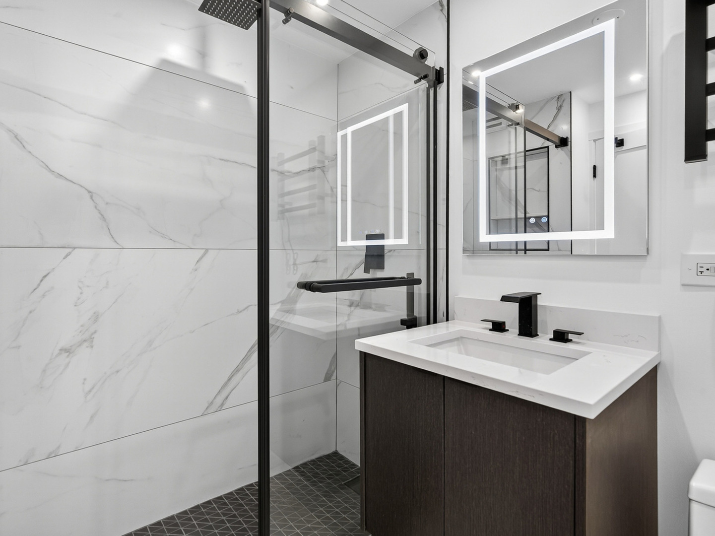 1455 North Sandburg Terrace, Unit 2403 Chicago, IL 60610 - Photo 19 of 22 a bathroom with a sink and a mirror