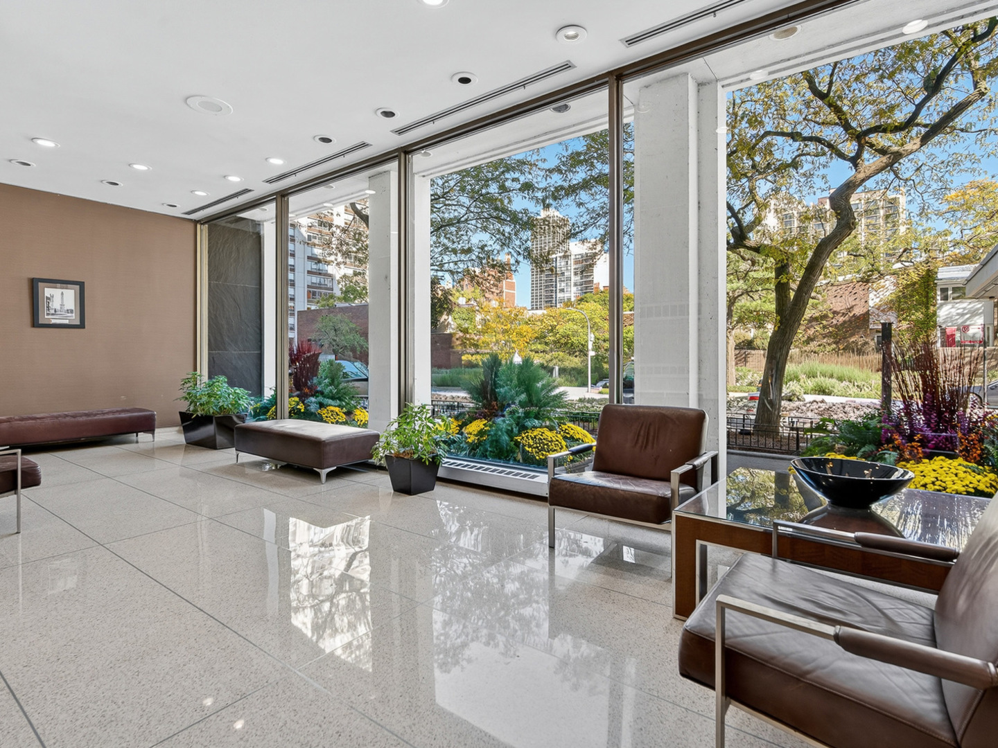 1455 North Sandburg Terrace, Unit 2403 Chicago, IL 60610 - Photo 21 of 22 a living room with furniture and a floor to ceiling window