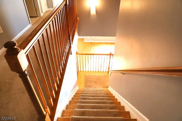 a view of a hallway with stairs