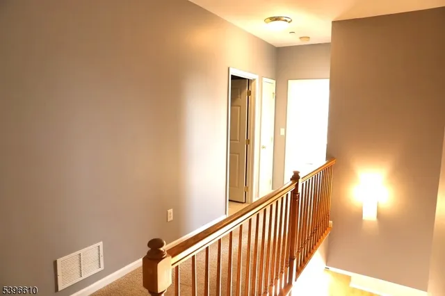 a view of a big room with carpet