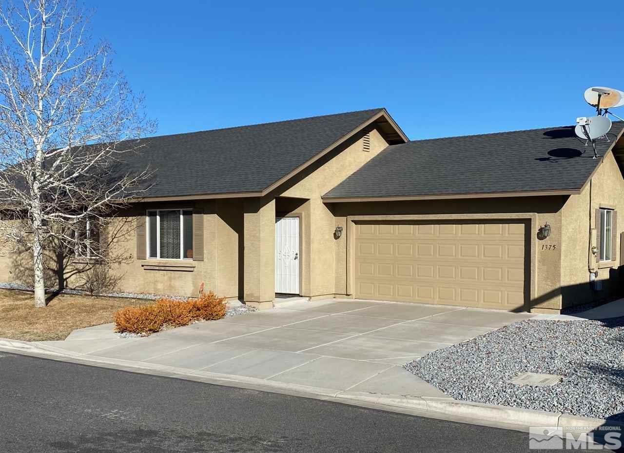 1375 Copper Leaf Drive Reno, NV 89506 - Photo 1 of 20 a front view of a house with a yard