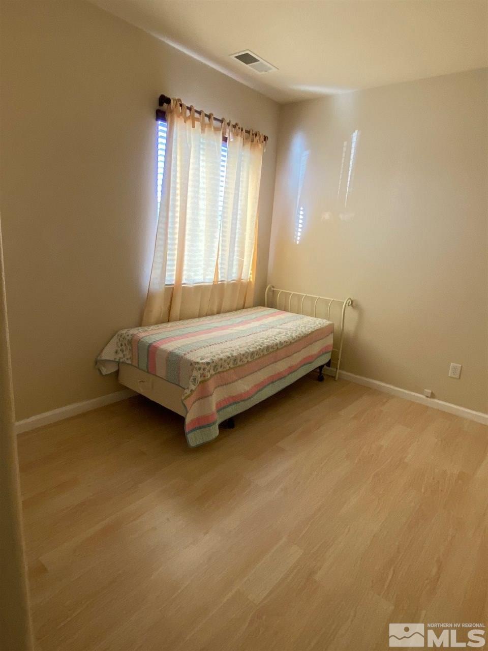 1375 Copper Leaf Drive Reno, NV 89506 - Photo 14 of 20 a room with a bed and a window