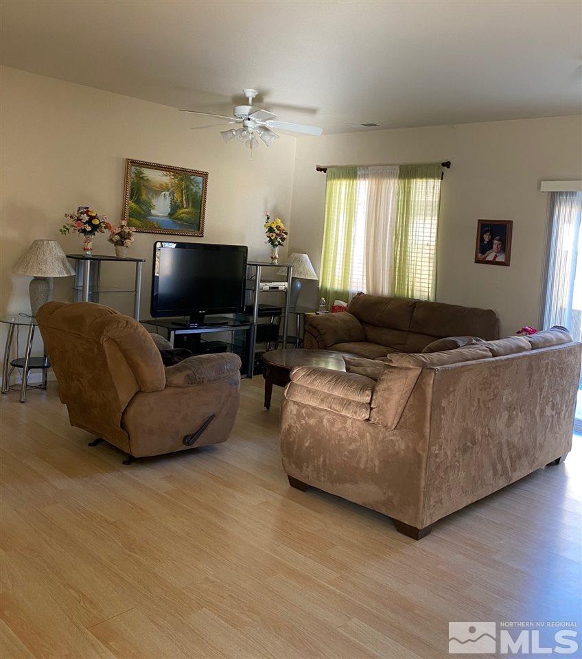 1375 Copper Leaf Drive Reno, NV 89506 - Photo 4 of 20 a living room with furniture and a flat screen tv