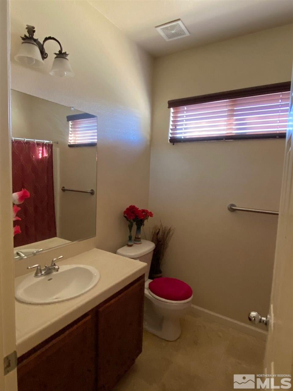 1375 Copper Leaf Drive Reno, NV 89506 - Photo 9 of 20 a bathroom with a sink toilet and shower