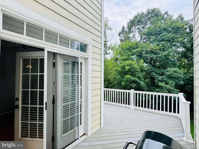 a view of a chair and table in the balcony