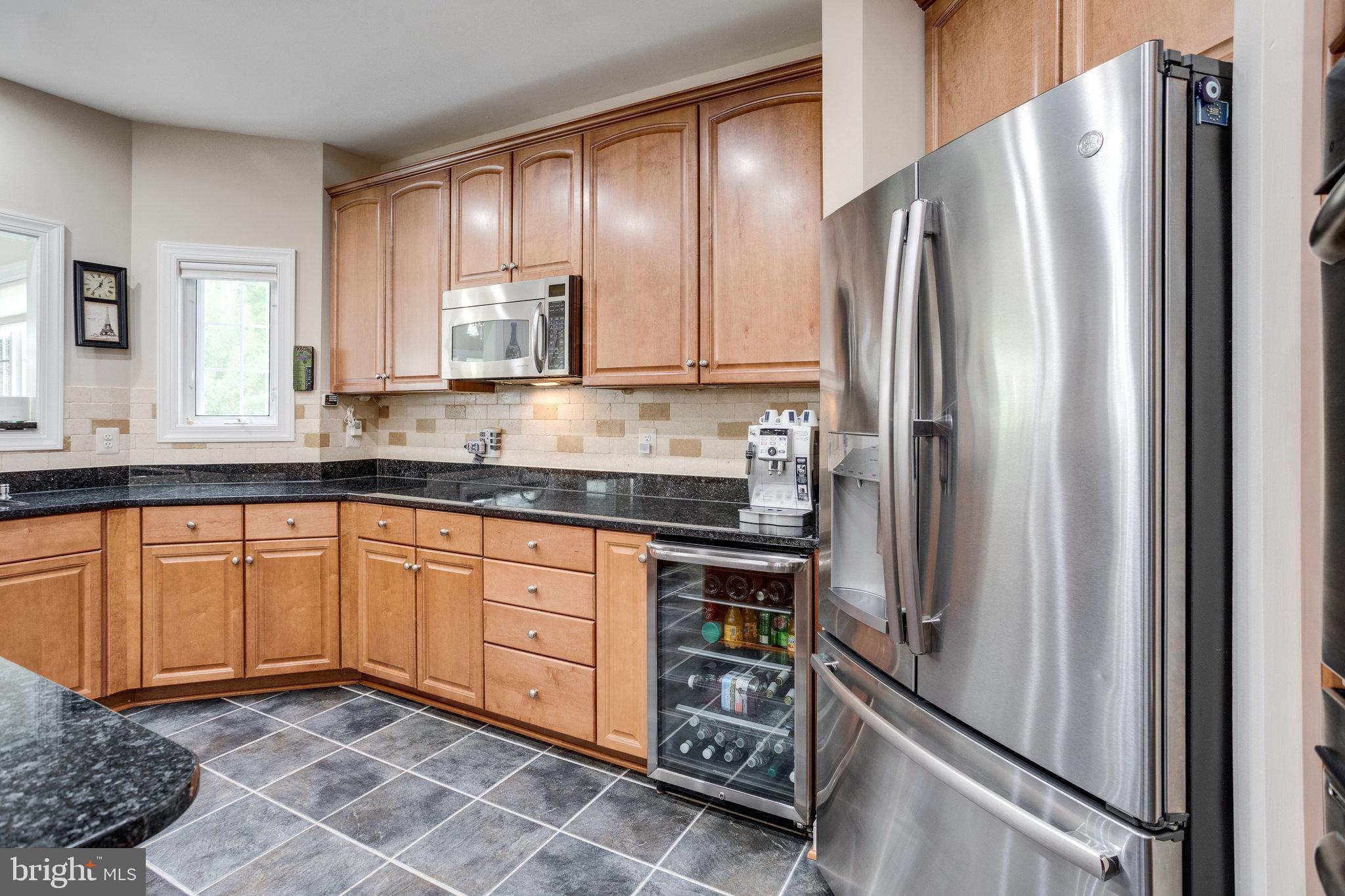 13195 Delaney Road Woodbridge, VA 22193 - Photo 32 of 88 Kitchen w/ / SS appliances & beverage cooler